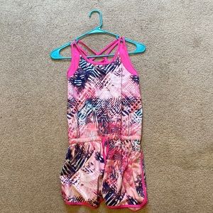 This is a multi-color romper. Great for summer time and easy to wash.